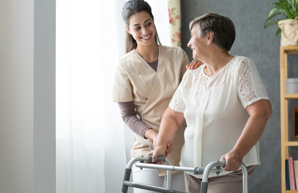 Caregiver Helping an Older Woman